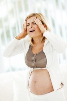 Hoofdpijn tijdens zwangerschap / Bron: Istock.com/skynesher